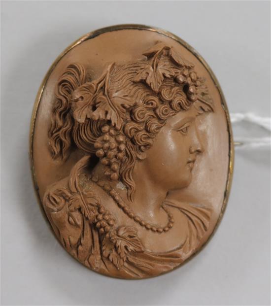 A Florentine carved larva cameo with brooch mount, 45mm.